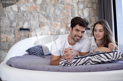 Image of couple relax and have fun in bed