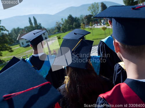 Image of young graduates students group