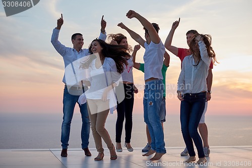 Image of party people  on sunset