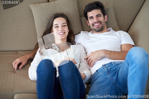 Image of happy young romantic couple have fun arelax  relax at home