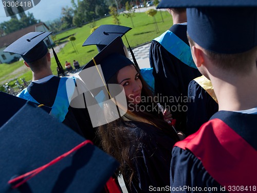 Image of young graduates students group