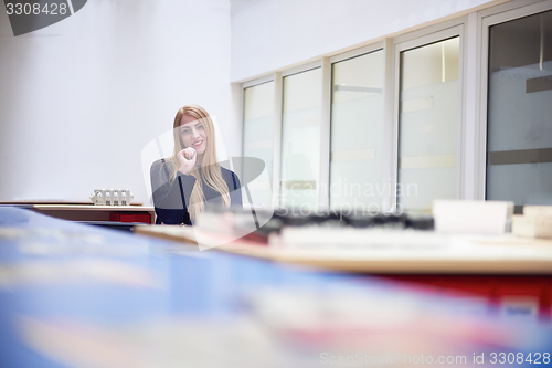 Image of business woman working on computer at office