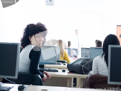 Image of students with teacher  in computer lab classrom