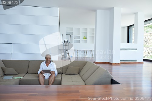 Image of Portrait of senior man relaxing in sofa