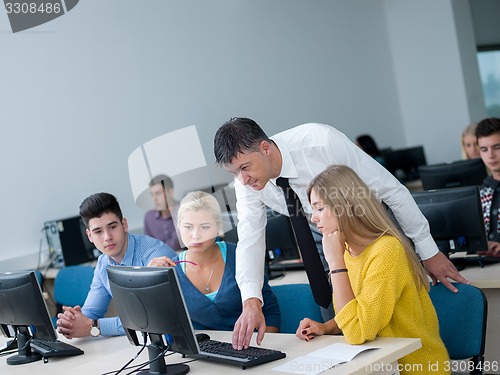 Image of students with teacher  in computer lab classrom
