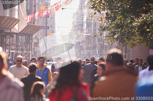 Image of people crowd walking on street