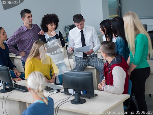 Image of students with teacher  in computer lab classrom