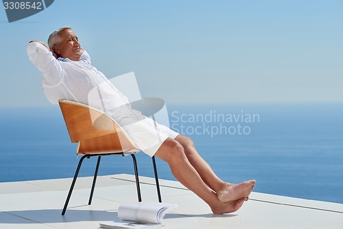 Image of senior man sitting outside