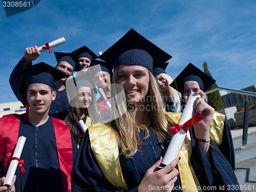 Image of young graduates students group