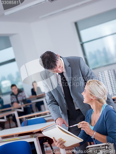 Image of students with teacher  in computer lab classrom