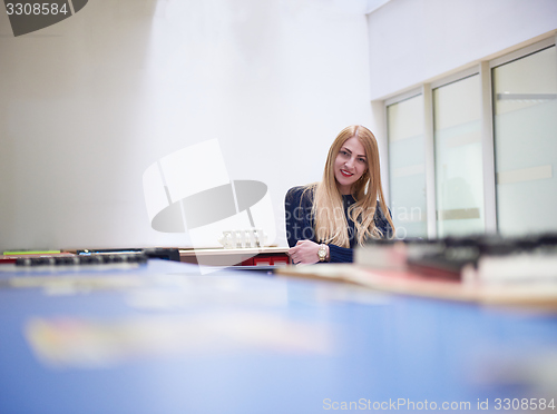 Image of business woman working on computer at office