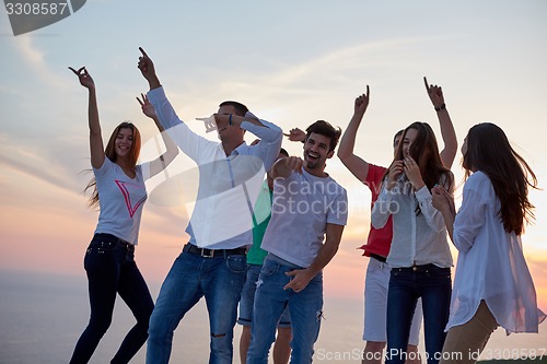 Image of party people  on sunset