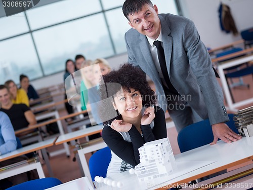 Image of students with teacher  in computer lab classrom