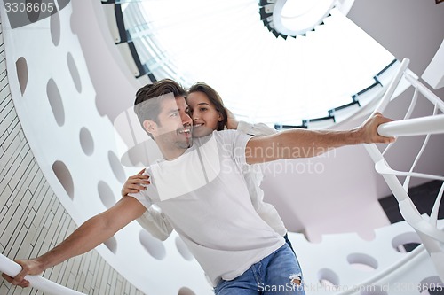 Image of relaxed yung couple at home  stairs