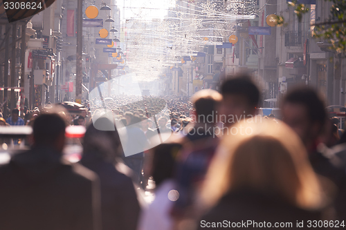 Image of people crowd walking on street