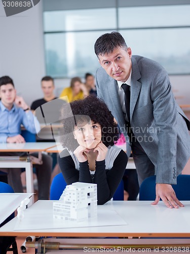 Image of students with teacher  in computer lab classrom