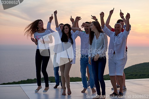 Image of party people  on sunset