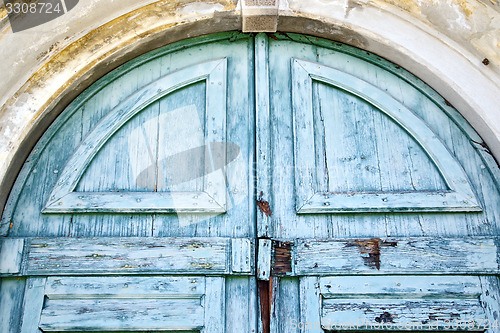 Image of   closed wood door carnago varese italy