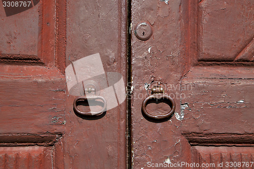 Image of   knocker and wood  door vinago  varese italy