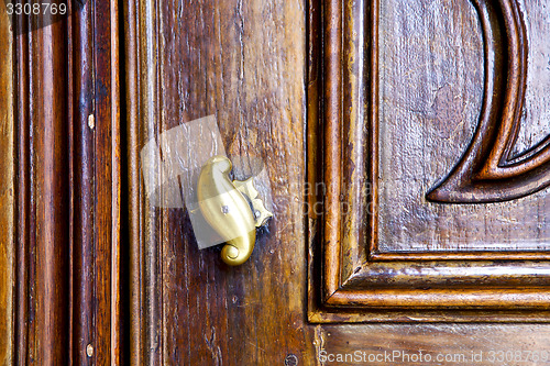 Image of abstract  rusty brass brown knocker  lonate ceppino varese italy