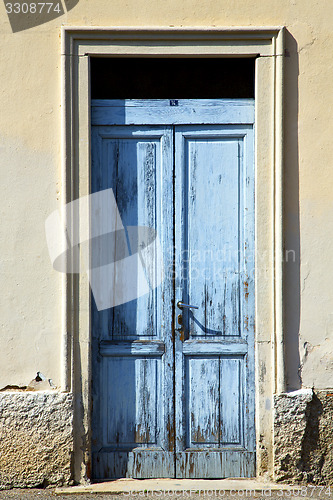 Image of abstract in venegono italy    and church door  