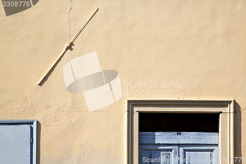 Image of   in venegono italy   the old  wall  and church door  