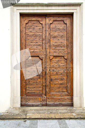 Image of old castronno   italy   the   wall  and church    door  