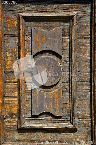 Image of castronno  varese   brown knocker  door  closed wood lombardy it