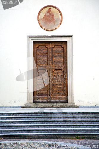 Image of old castronno   wall  and church door  