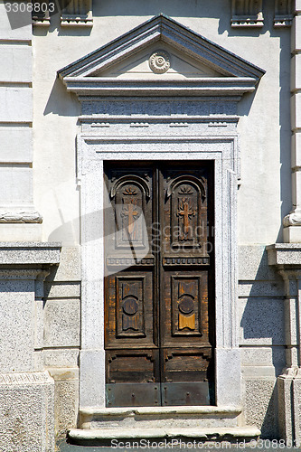 Image of old castronno abstract in  italy    and church door  