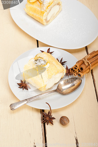 Image of cream roll cake dessert and spices 