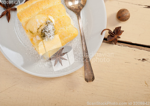 Image of cream roll cake dessert and spices 