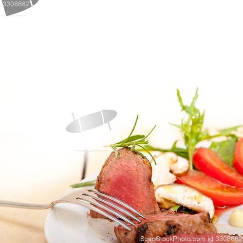 Image of beef filet mignon grilled with vegetables