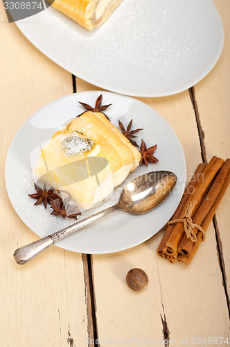 Image of cream roll cake dessert and spices 