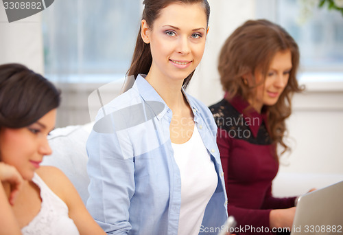 Image of Three girls and a notebook