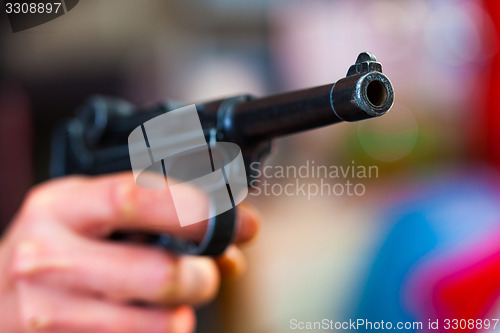 Image of Luger Parabellum automatic pistol in a human hand