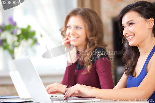 Image of two students in class