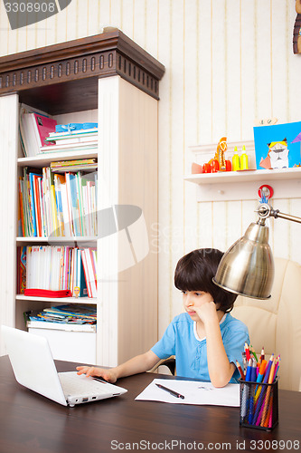 Image of schoolboy doing homework