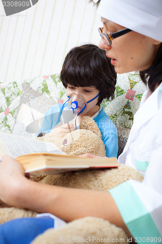 Image of family doctor makes the child inhalation