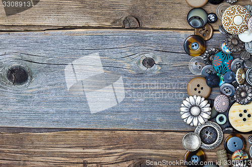 Image of vintage buttons on aged table