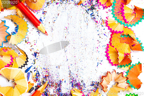 Image of ART word on the background of colored pencil shavings