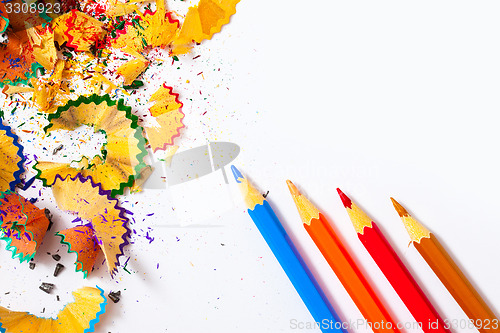 Image of colored pencils and shavings on white