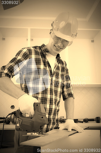 Image of worker with jigsaw