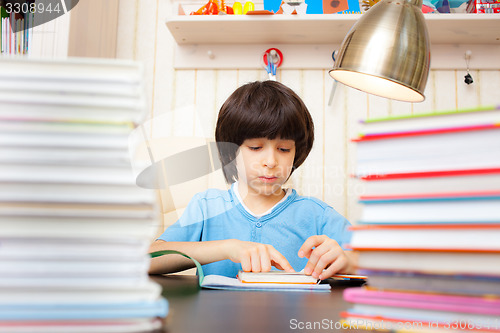 Image of child reading a book
