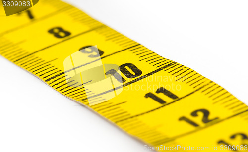 Image of Yellow measuring tape isolated - selective focus