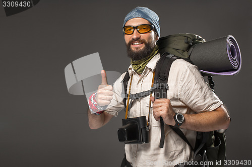 Image of Portrait of a smiling male fully equipped tourist 