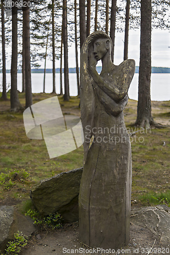 Image of Idol of woman in forest