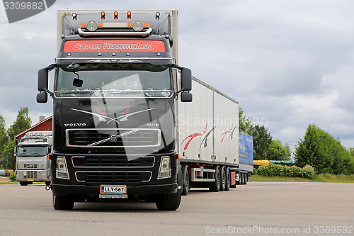 Image of Black Volvo FH16 Leaving Truck Stop