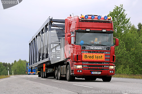 Image of Scania 164L 580 Semi Truck Hauls a Wide Load