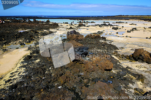 Image of people footstep coaststone  volcanic spain   